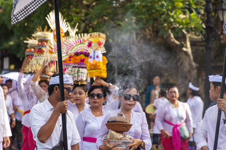 People in traditional clothes on the streets of Ubud, Baliのeditorial素材