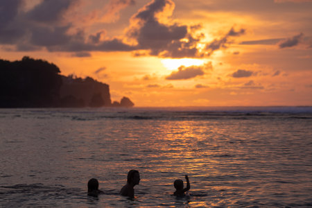 People on the Bingin Beach at sunset, Uluwatu, Bali Island, Indonesiaのeditorial素材