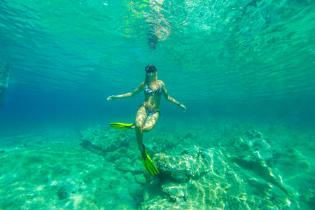 A young woman is free diving on the Adriatic Sea, Croatiaのeditorial素材