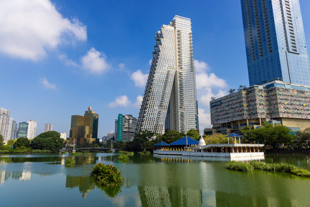 Modern Colombo skyline overlooking a lakeside with floating islands and egrets, Sri Lankaのeditorial素材