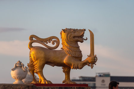 Golden Sinhalese lion statue at sunset in Colombo, Sri Lankaのeditorial素材