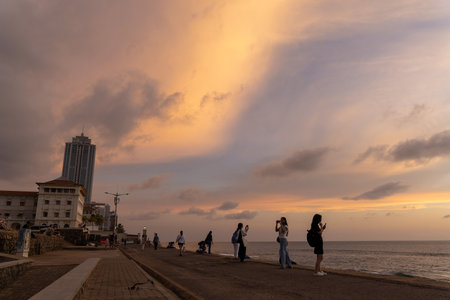 People enjoying the Colombo seafront at sunset, Sri Lankaのeditorial素材