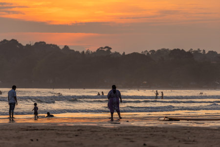 Public town beach in Weligama at sunset, Sri Lankaのeditorial素材