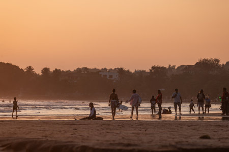Public town beach in Weligama at sunset, Sri Lankaのeditorial素材