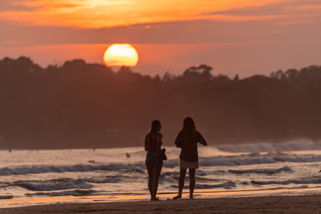 Public town beach in Weligama at sunset, Sri Lankaのeditorial素材