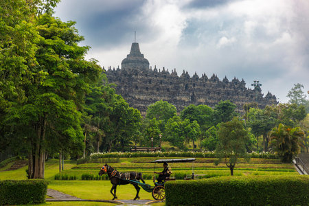 Borobudur Temple with Traditional Javanese Horse Carriage, Java, Indonesiaのeditorial素材