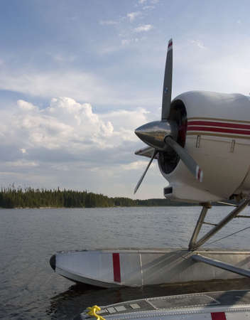 a float plane tied up on a dock in Quebecの写真素材