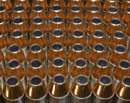 cartridges for 45 ACP pistols that are topped with hollow pointsの写真素材