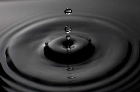 drips that are creating ripples in the water surfaceの写真素材
