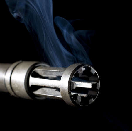 smoke coming from a barrel and flash hider after shootingの写真素材
