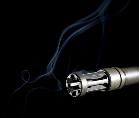 smoke leaving a barrel just after the bullet is goneの写真素材