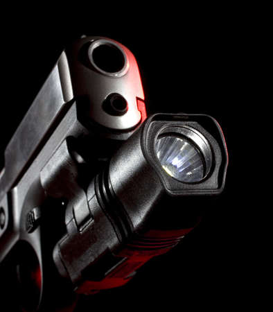 weaponlight that is mounted on a semi-automatic handgunの写真素材