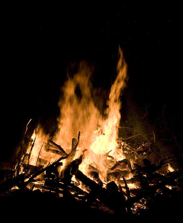 Night campfire that has plenty of coals and lots of fuelの写真素材