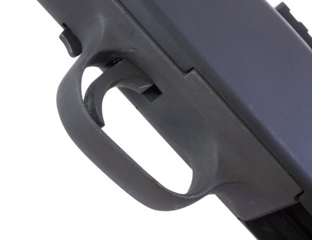 Isolated view from the bottom of a black shotgun trigger