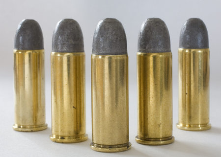 Five cartridges with lead bullets made for 44 special guns