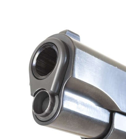 Muzzle end of a classic semi automatic pistol that is isolatedの写真素材