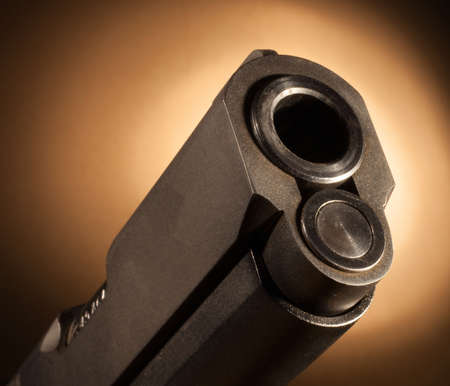 Business end of a semi auto handgun barrelの写真素材