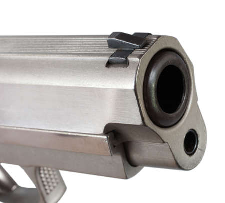 Barrel of a handgun and front sight isolated on whiteの写真素材