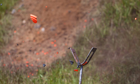 Fragments of a clay target fly after being shot