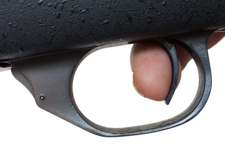 Finger on the trigger of a high powered rifle