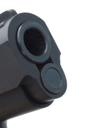 Muzzle end of a handgun isolated on whiteの写真素材