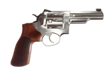 Revolver with a stainless barrel and wood grip on whiteの写真素材