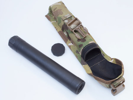 Silencer with its case and took for disassembly on white