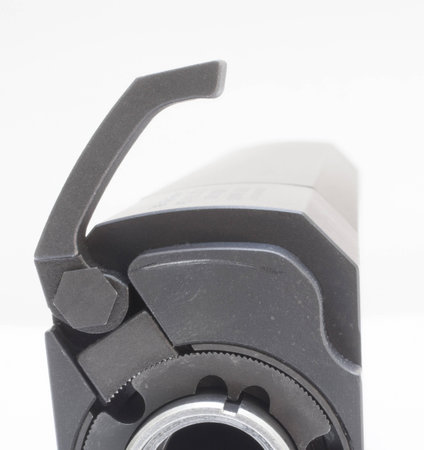 Throw lever that is open on the muzzle end of a silencer