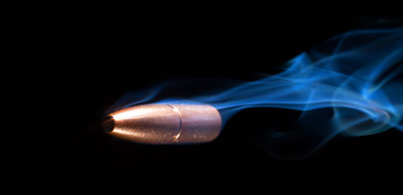 Smoking bullet flying from right to left by the camera