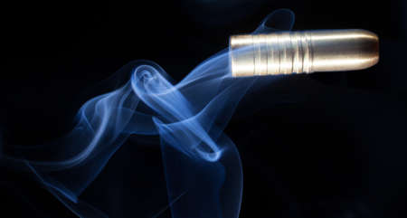 Rifle bullet en route with bands and following smokeの写真素材