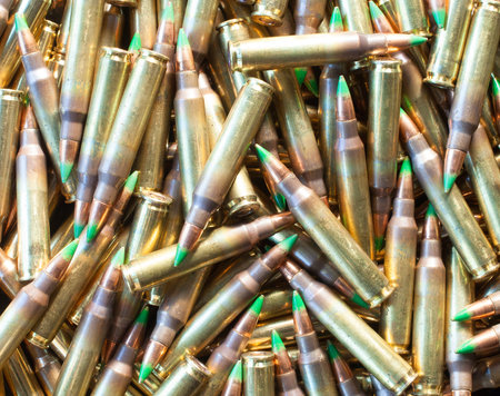 Rifle cartridges loaded with bullets that have a green tip