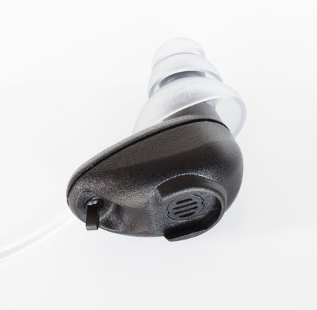 Digital units that goe in the ear and amplify non harmful sounds isolated on white