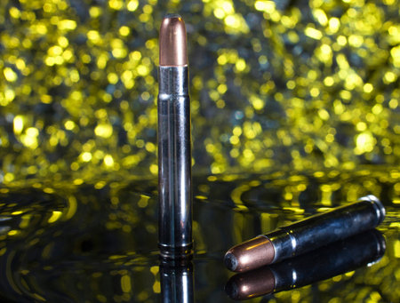 Cartridges and bullets for hunting big game in Africa with a yellow background