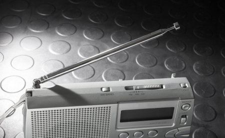 Metal antenna on a battery powered radio designed to receive broadcast and shortwave