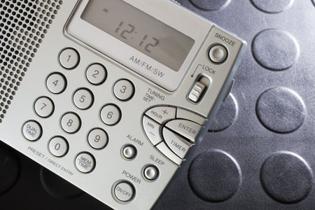 Controls on a battery powered portable radio that has a clock functionの写真素材