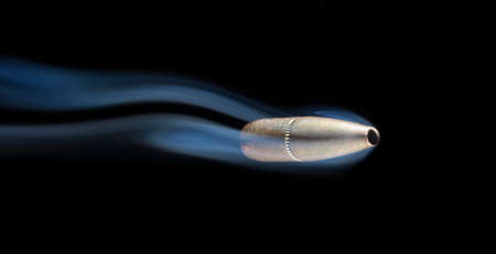Bullet and smoke that looks like they are approaching fastの写真素材