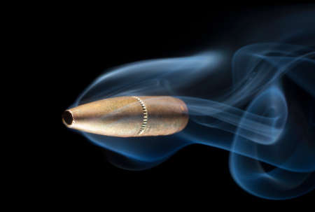 Bullet with copper plating that looks like it on its way down rangeの写真素材