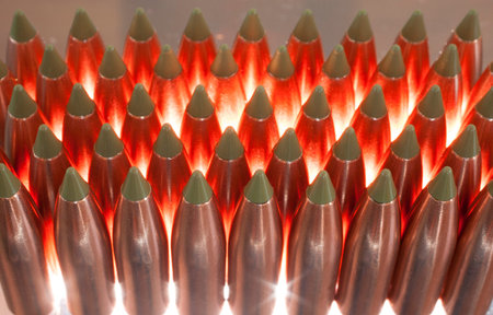 Copper bullets with a green polymer tip that are back lit