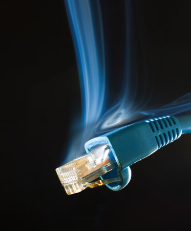 Networking computer connection that is smoking on a black background