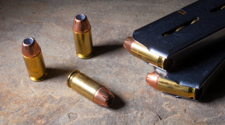Cartridges with hollow point bullets and magazines for a semi automatic handgun