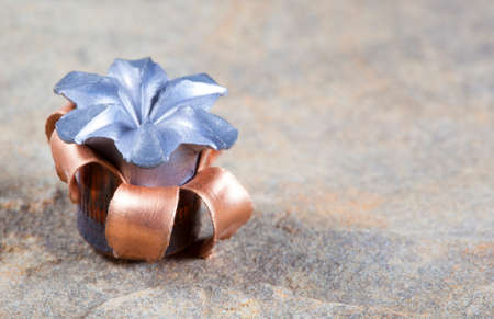 Expanded copper jacketed hollow point bullet after impactの写真素材