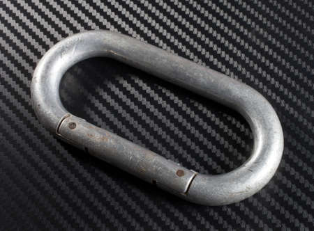 Aluminum carabiner that shows marks from years of useの写真素材