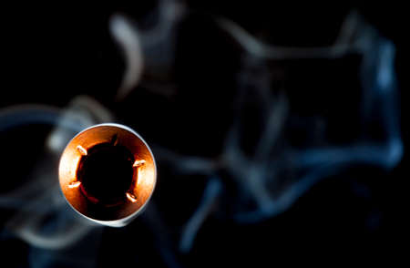 Hollow point bullet with smoke about to fly by the cameraの写真素材