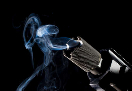Smoke around a barrel after a single shot on a black backgroundの写真素材
