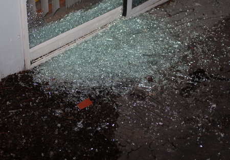 Sliding glass door that has been shattered as a home invader tried to come into a house