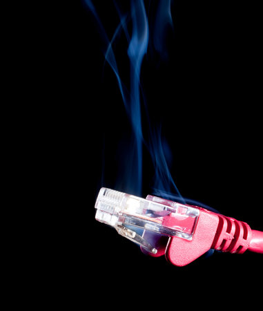 Red network connection for a computer on black with smoke rising