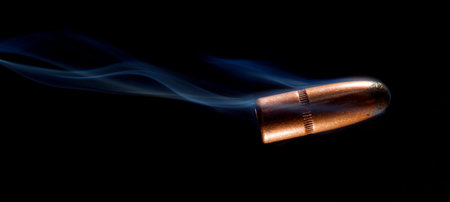 Bullet that looks like it is starting to tumble with smoke