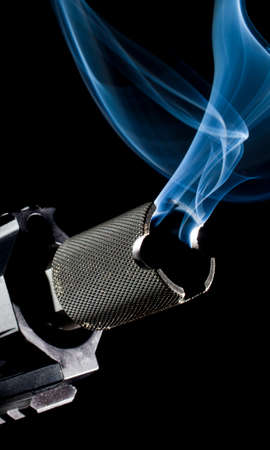 Muzzle side of the barrel on an assault rifle smokingの写真素材