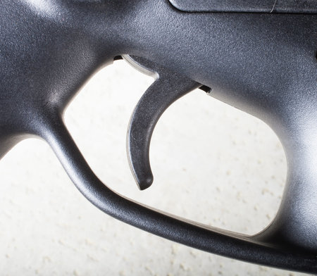 Trigger on a rifle that has a receiver made of polymer