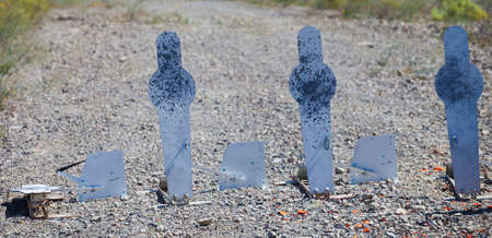 One of four steel shotgun targets that has been hitの写真素材